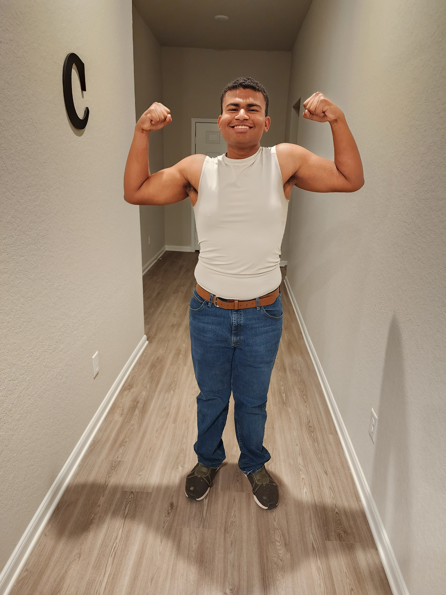 Jaiden flexing with a big smile